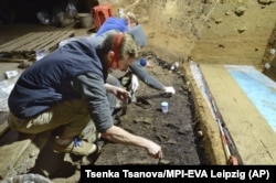 This image provided by Tsenka Tsanova in May 2020 shows excavation work at the Bacho Kiro Cave in Bulgaria. 