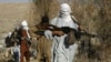 FILE - Armed Taliban fighters are seen at an undisclosed location in Nangarhar province, Afghanistan, Dec.13, 2010. Taliban fighters are currently engaged in clashes with Islamic State militants in the region.