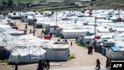 روج کیمپ میں بچے اور عورتیں